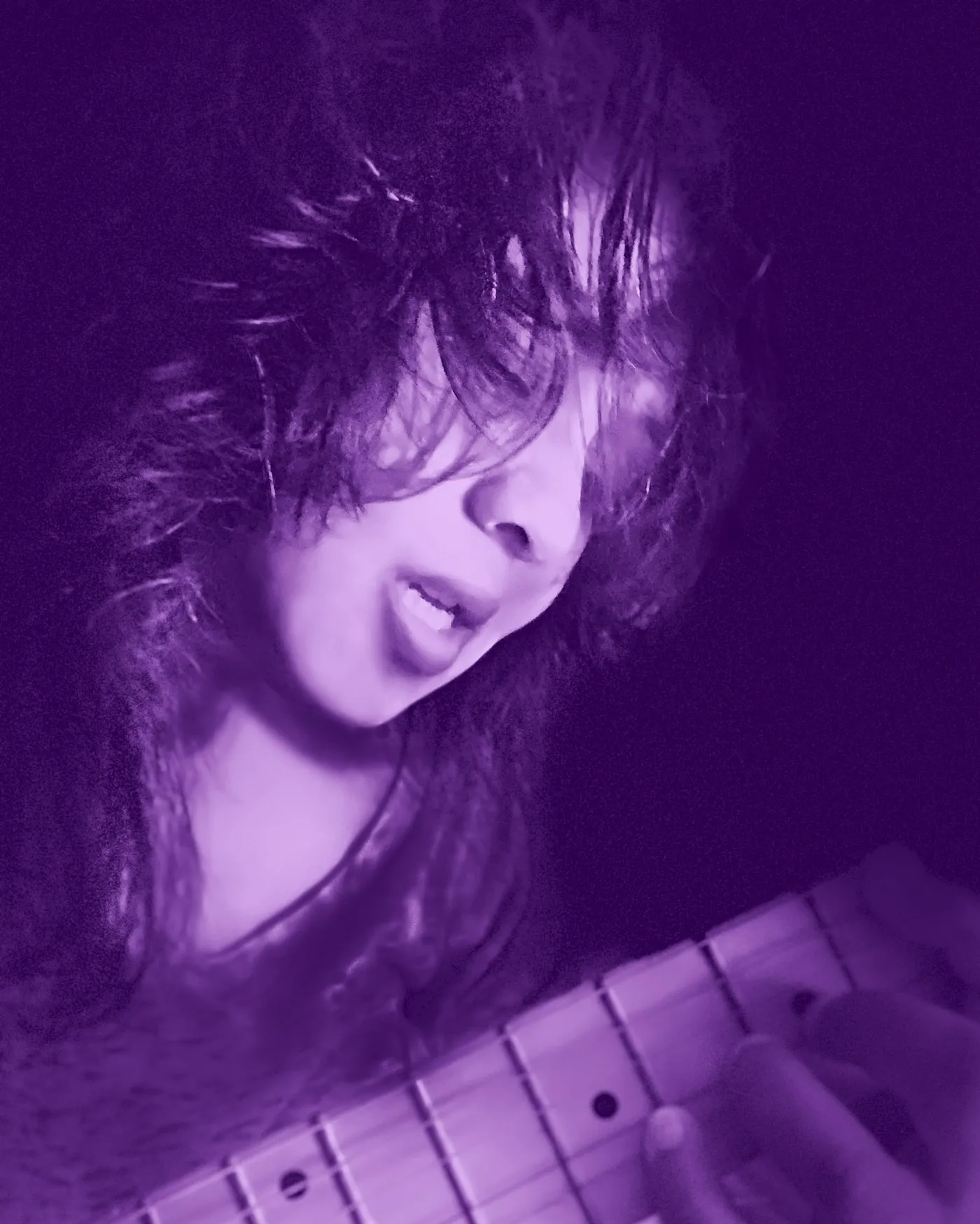 Anjalts playing electric guitar, black and white